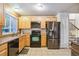 The kitchen features tile floors, stainless steel appliances, and wooden cabinets at 18601 E Louisiana Ave, Aurora, CO 80017
