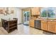 The kitchen features tile floors, stainless steel appliances, and wood cabinets at 18601 E Louisiana Ave, Aurora, CO 80017
