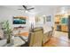 Cozy living room featuring hardwood floors, a ceiling fan, and neutral wall colors at 18601 E Louisiana Ave, Aurora, CO 80017