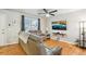 Living room offers hardwood floors, a large window, and comfortable seating at 18601 E Louisiana Ave, Aurora, CO 80017