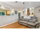 Open concept living room featuring hardwood floors and a view of the kitchen and stairs at 18601 E Louisiana Ave, Aurora, CO 80017