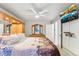 Main bedroom with a ceiling fan and a television on the wall at 18601 E Louisiana Ave, Aurora, CO 80017