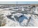 Aerial view showing a house's location in a residential area with snow on the ground at 329 Lilac Dr, Lochbuie, CO 80603