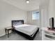 Serene bedroom with grey carpet and window coverings at 329 Lilac Dr, Lochbuie, CO 80603