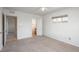 Neutral bedroom featuring a ceiling fan and access to the bathroom and hallway at 1077 Salem St, Aurora, CO 80011