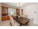 Inviting dining room featuring a large table, six chairs, and built-in cabinets at 1077 Salem St, Aurora, CO 80011