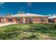 Inviting one-story brick home featuring a manicured lawn and classic design, with an accessible front entrance at 1077 Salem St, Aurora, CO 80011