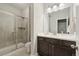This bathroom features a glass-enclosed shower and a dark wood vanity with a white countertop at 10929 Endeavor Dr, Parker, CO 80134