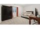 Bedroom featuring a bed, wardrobe, desk and egress window at 10929 Endeavor Dr, Parker, CO 80134