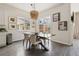 Charming dining room with modern lighting, stylish decor, and easy access to the outdoor patio at 10929 Endeavor Dr, Parker, CO 80134