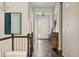 Bright hallway features dark hardwood floors, elegant decor, and plenty of natural light from the front door at 10929 Endeavor Dr, Parker, CO 80134