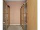 Spacious walk-in closet with custom wood shelving and ample storage space at 10929 Endeavor Dr, Parker, CO 80134