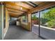 Unfinished basement featuring exposed wood beams and a sliding glass door to a yard area at 12771 W 6Th Pl, Lakewood, CO 80401