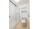 Bright bathroom featuring a glass-enclosed shower with white subway tile surround and neutral fixtures at 12771 W 6Th Pl, Lakewood, CO 80401