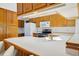 Bright kitchen featuring white countertops, stainless steel appliances, and classic wood cabinetry at 12771 W 6Th Pl, Lakewood, CO 80401