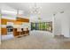 Open-concept living space featuring a breakfast bar, large windows and natural lighting at 12771 W 6Th Pl, Lakewood, CO 80401