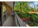 Wooden deck overlooking lush backyard greenery, offering a serene outdoor space at 12771 W 6Th Pl, Lakewood, CO 80401