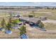 Aerial view showcasing the home, outdoor deck, RV, landscaping, and the expansive property at 40192 Margaret Dr, Elizabeth, CO 80107