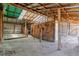 Rustic barn interior with wooden beams and hay on the ground at 40192 Margaret Dr, Elizabeth, CO 80107