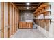 Unfinished basement space with exposed beams, cabinetry and shelving potential at 40192 Margaret Dr, Elizabeth, CO 80107