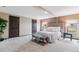 Large bedroom featuring plush carpeting, two windows, and ample closet space at 40192 Margaret Dr, Elizabeth, CO 80107