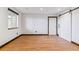 Bright room with hardwood floors, barn door, and trim with rustic finish at 40192 Margaret Dr, Elizabeth, CO 80107
