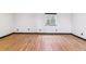 Empty bedroom with hardwood floors, small window with coverings, and white walls at 40192 Margaret Dr, Elizabeth, CO 80107