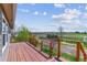 Enjoy the view from this spacious deck with wooden railing and natural surroundings at 40192 Margaret Dr, Elizabeth, CO 80107