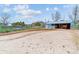 Equestrian facility featuring an open area, fencing, and a covered shelter for horses or livestock at 40192 Margaret Dr, Elizabeth, CO 80107