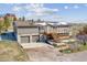 Two-story home with a two-car garage, wooden deck, and stairs leading to the entrance at 40192 Margaret Dr, Elizabeth, CO 80107
