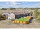 Aerial view of backyard with deck, patio, hot tub and well-maintained lawn at 40192 Margaret Dr, Elizabeth, CO 80107