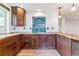 Beautiful kitchen with custom wood cabinets, unique backsplash, stainless appliances, and wood countertop at 40192 Margaret Dr, Elizabeth, CO 80107