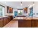Beautiful kitchen with custom wood cabinets, unique backsplash, stainless appliances, and wood countertop at 40192 Margaret Dr, Elizabeth, CO 80107
