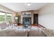 Inviting living room with fireplace, hardwood floors, comfortable sofa and picturesque window views at 40192 Margaret Dr, Elizabeth, CO 80107