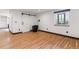 Living space with hardwood floors, wood stove, barn door, and white walls at 40192 Margaret Dr, Elizabeth, CO 80107