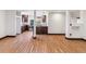 Open living space with hardwood floors, recessed lights, wood trim, and kitchen at 40192 Margaret Dr, Elizabeth, CO 80107