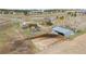 Aerial view of property including barn and riding area in rural setting at 40192 Margaret Dr, Elizabeth, CO 80107