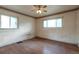 Bedroom featuring hardwood floors, natural light, and neutral walls at 1335 Locust St, Denver, CO 80220