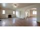 Spacious living room with hardwood floors, a fireplace, and natural light at 1335 Locust St, Denver, CO 80220