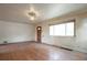 Bright living room featuring hardwood floors and a front entrance at 1335 Locust St, Denver, CO 80220
