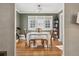 Bright dining area with hardwood floors and built-in shelving at 4855 Knox Ct, Denver, CO 80221