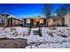 Charming single-story home with classic design elements, landscaped yard and inviting front entrance at 4855 Knox Ct, Denver, CO 80221