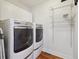 Functional laundry room with updated appliances and ample storage at 4855 Knox Ct, Denver, CO 80221