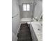 Bathroom featuring a vanity with a white countertop, tiled walls, and updated fixtures at 8947 Rutgers St, Westminster, CO 80031