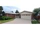 Charming brick home with a two-car garage and well-maintained front yard and long driveway at 8947 Rutgers St, Westminster, CO 80031