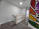 Hallway with white cabinet storage and a colorful mural wall at 8947 Rutgers St, Westminster, CO 80031