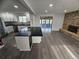 Open-concept kitchen and living space, featuring stainless steel appliances and a fireplace at 8947 Rutgers St, Westminster, CO 80031