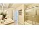 Bathroom featuring a shower-tub combo and a framed floral print at 7695 E Quincy Ave # 207, Denver, CO 80237