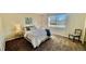 Bright bedroom featuring a large window and neutral tones at 7695 E Quincy Ave # 207, Denver, CO 80237