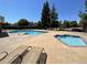 Community swimming pool and hot tub with lounge chairs for relaxation and enjoyment at 5550 W 80Th Pl # 20, Arvada, CO 80003